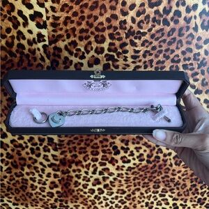 Silver juicy couture Charm Bracelet comes with one charm!!